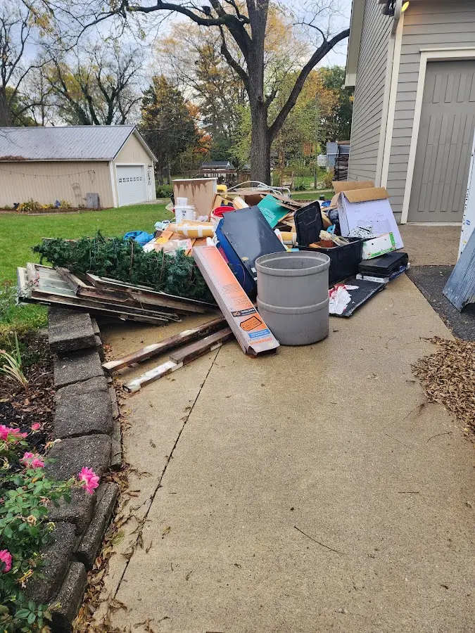 Dumpster being loaded with debris for Roofing Dumpster Rental in Zelienople
